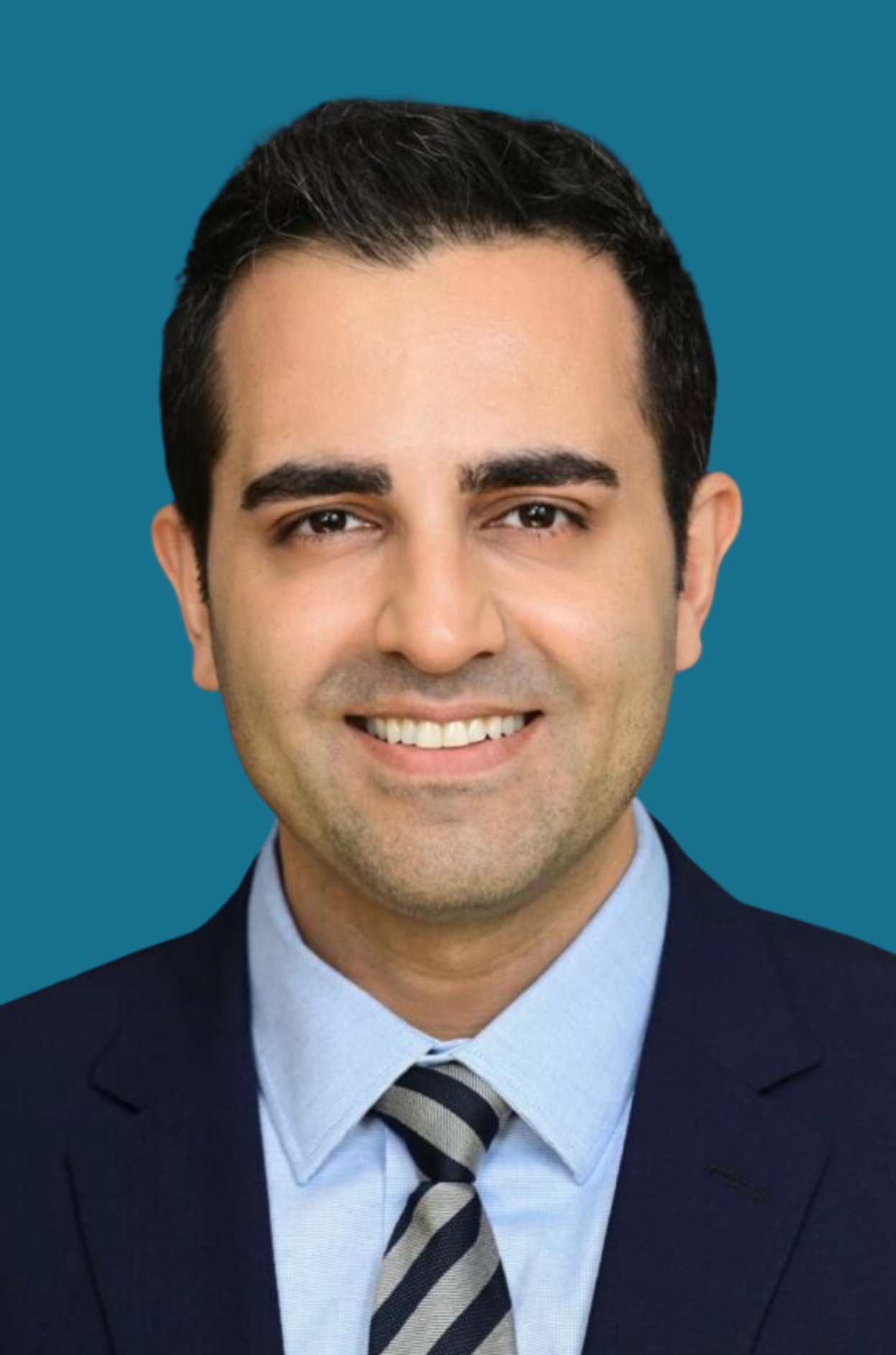 Jorge Caso MD w background copy Dr. Babak Azad in a blue suit